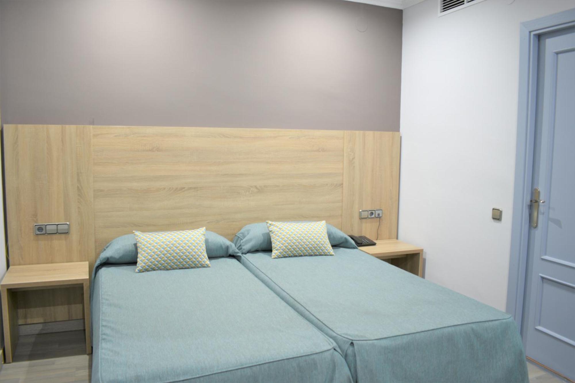 Economische Tweepersoonskamer met 1 of 2 Bedden - Interieur