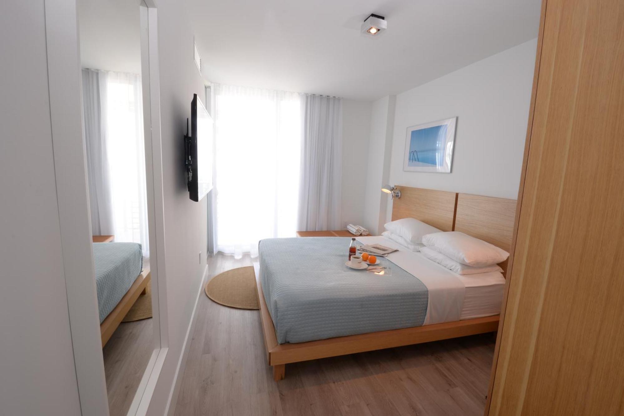 Suíte de 1 quarto com vista da baía, cozinha compacta e varanda