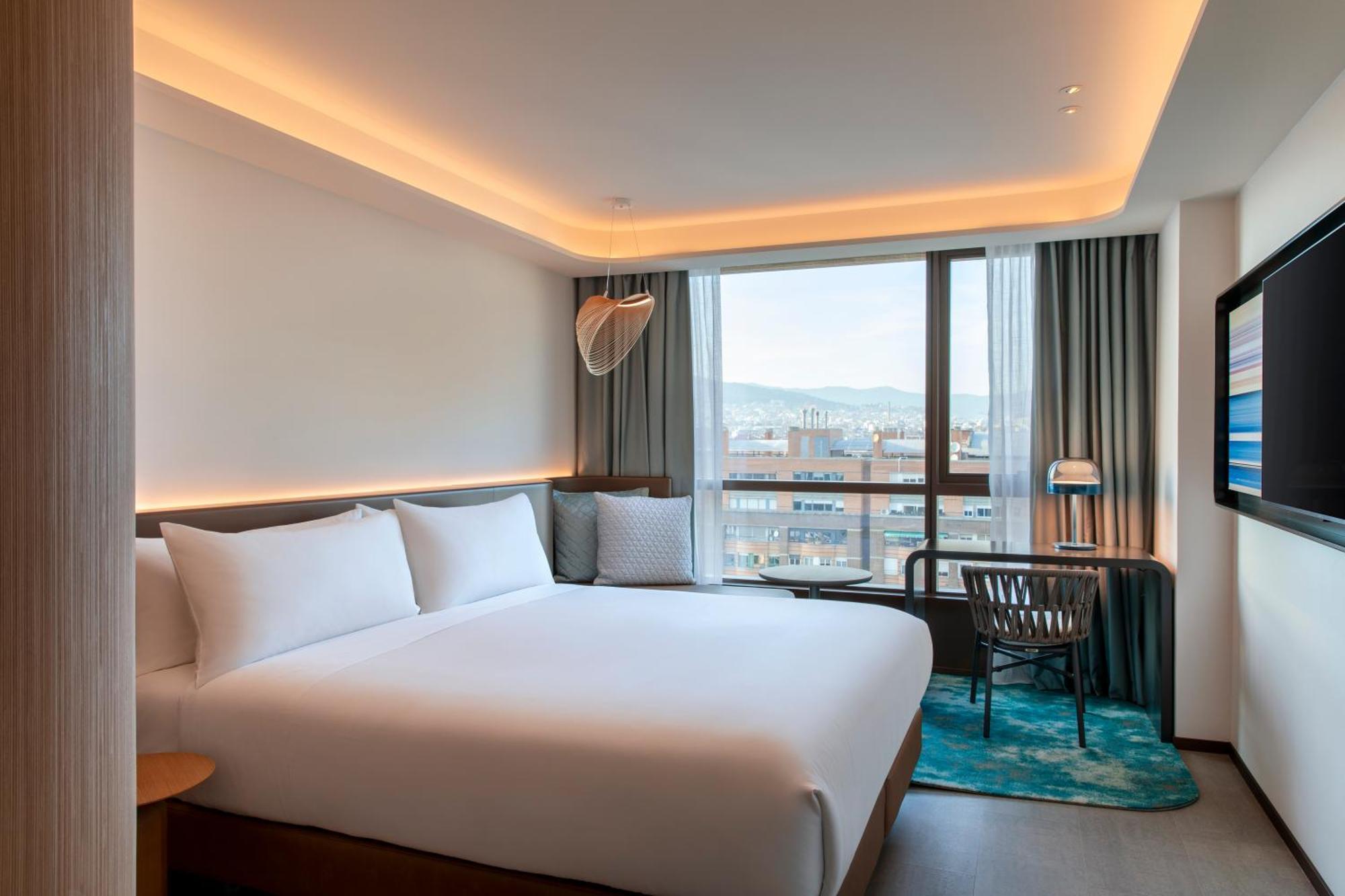 Kamer met Kingsize Bed en Uitzicht op de Stad