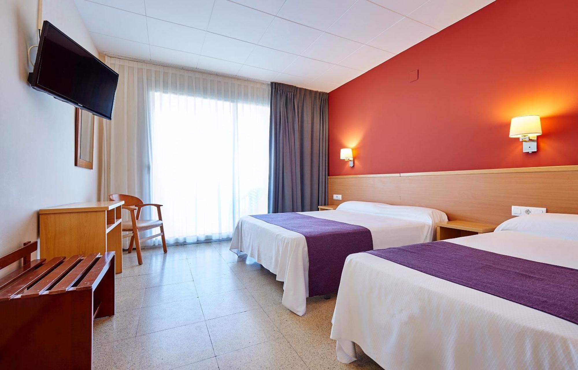 Chambre Double Économique avec Lit d'Appoint (2 Adultes + 2 Enfants)