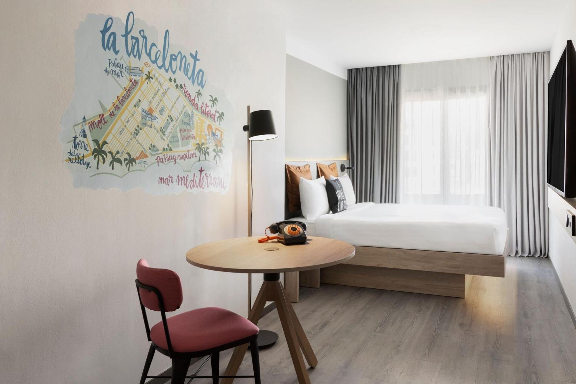 Moxy Kamer met Queensize Bed en Uitzicht op de Stad