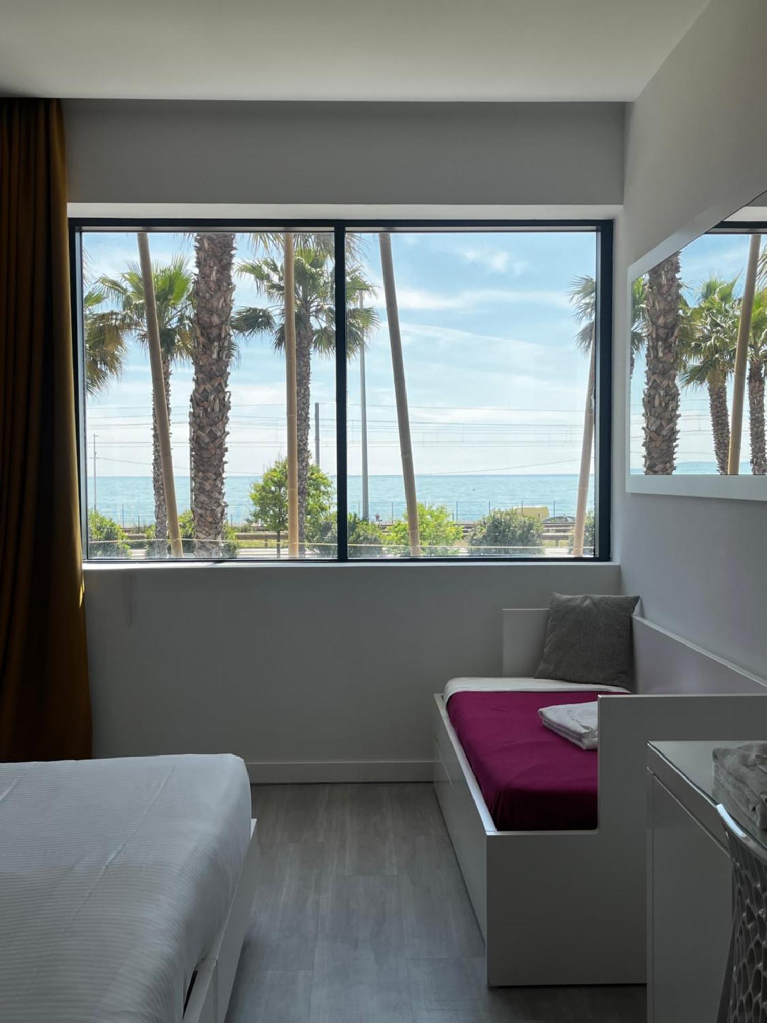 Dreibettzimmer mit Meerblick