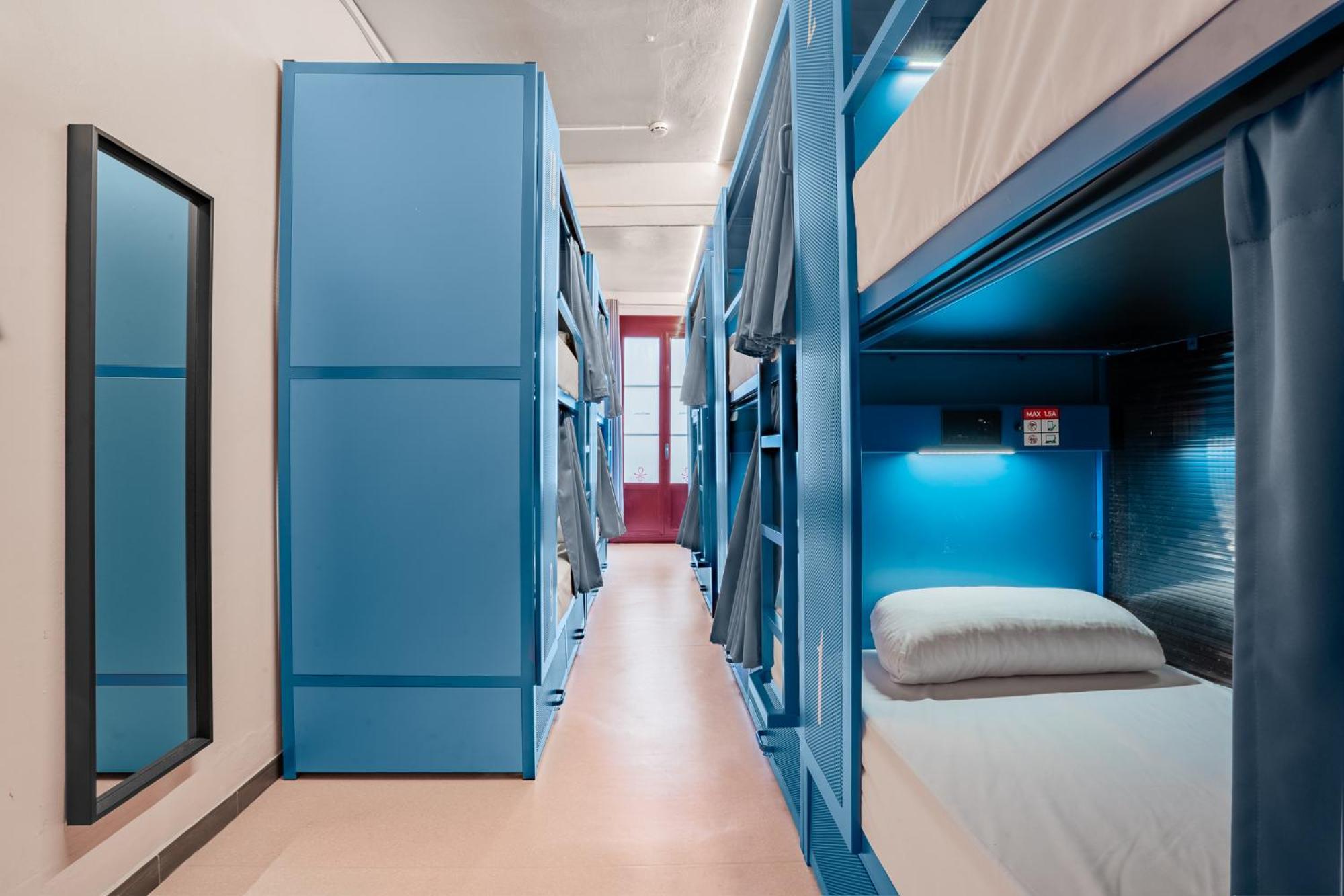 Bed in 10 Beds Mixed Room with Shared Bathroom.