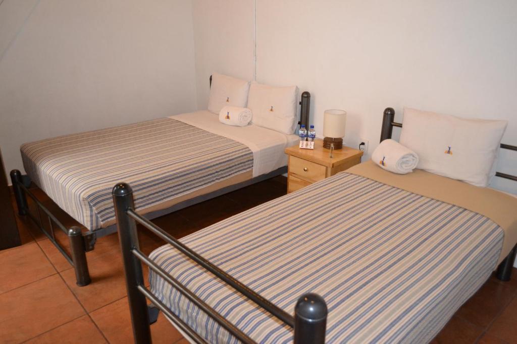 Double Room with Two Double Beds and Private Bathroom