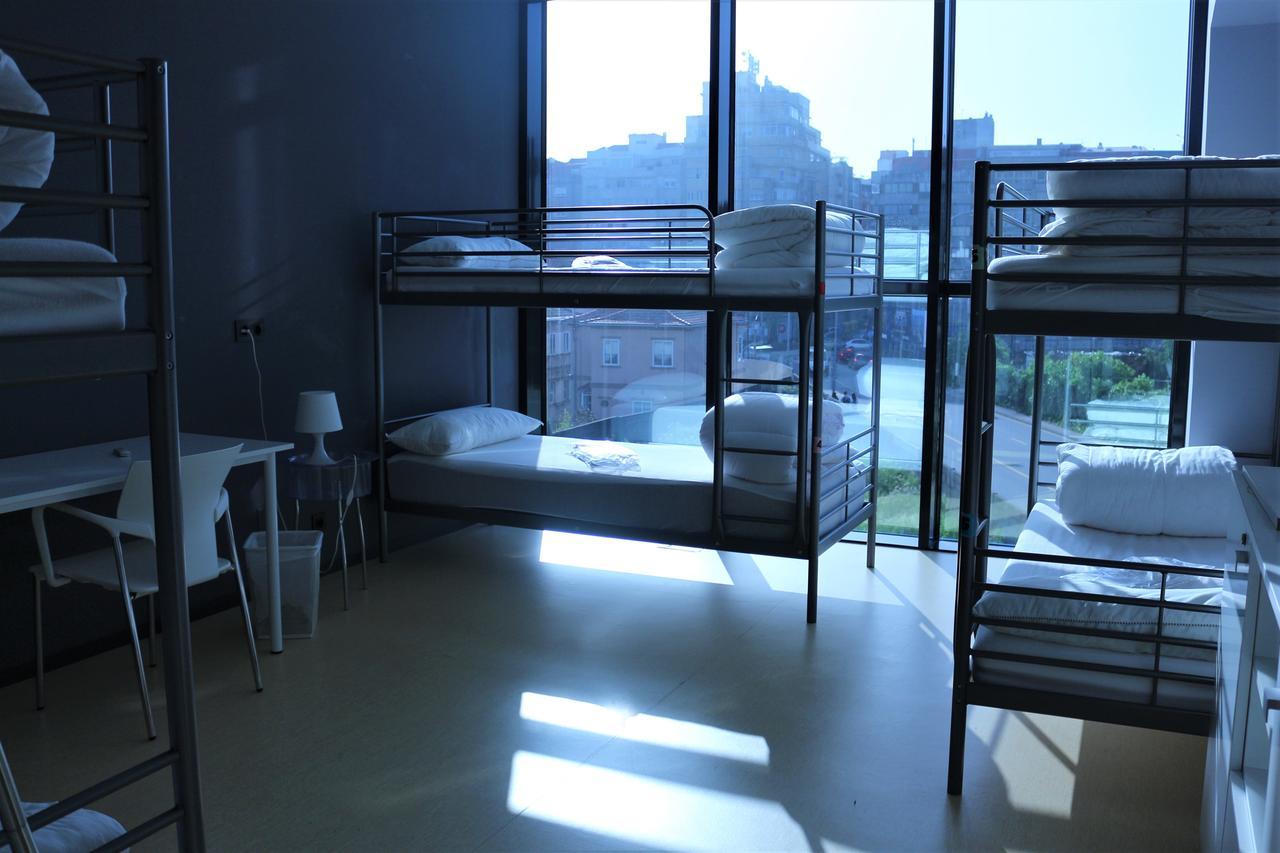 Cama en habitación compartida de 6 camas