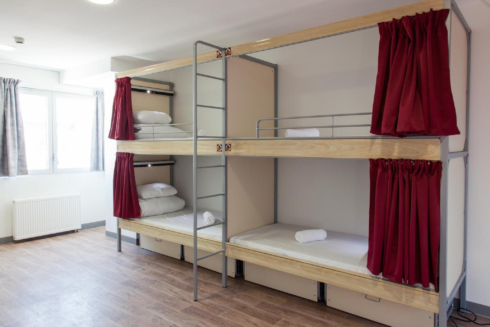 Bed in 4-Bed Dormitory Room with Shared Bathroom
