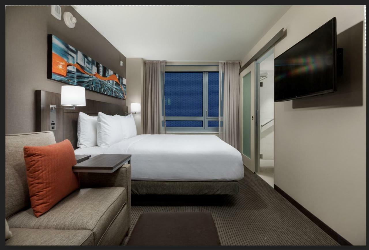 Kamer met Kingsize Bed en Uitzicht op de Stad